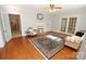 Cozy living room featuring hardwood floors, fireplace, and lots of natural light at 309 S Greene St, Wadesboro, NC 28170