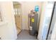 Cozy utility room with hot water heater, leading to a bright outdoor space at 309 S Greene St, Wadesboro, NC 28170
