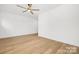 Spacious bedroom with hardwood flooring and a ceiling fan, perfect for relaxing at 3119 Shenandoah Ave, Charlotte, NC 28205