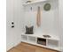 Entryway with a built-in bench, storage shelves, and modern decor at 3119 Shenandoah Ave, Charlotte, NC 28205
