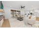 Bright open-concept living area with a seamless transition to the kitchen and a view of the outdoors at 3119 Shenandoah Ave, Charlotte, NC 28205