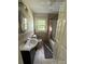Cozy bathroom featuring a vanity, toilet, shower, and natural lighting at 322 Buffalo St, Shelby, NC 28150