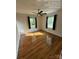 Inviting bedroom with polished hardwood flooring, neutral walls, and natural light from the windows at 322 Buffalo St, Shelby, NC 28150