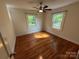 Bedroom featuring hardwood floors, a ceiling fan, and natural light from multiple windows at 322 Buffalo St, Shelby, NC 28150