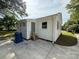 Rear exterior of the property featuring a concrete patio and a light-colored exterior at 322 Buffalo St, Shelby, NC 28150