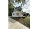 Quaint home with white exterior, traditional shutters, and a covered front porch at 322 Buffalo St, Shelby, NC 28150