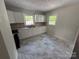 Updated kitchen with white cabinets, modern countertops, and new appliances at 322 Buffalo St, Shelby, NC 28150