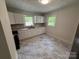 Updated kitchen with white cabinets, modern countertops, and new appliances at 322 Buffalo St, Shelby, NC 28150