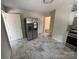 Updated kitchen with stainless steel refrigerator, white cabinets, modern countertops, and new appliances at 322 Buffalo St, Shelby, NC 28150