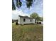 Image displaying the back of a single-story home with a well-maintained lawn and functional exterior at 322 Buffalo St, Shelby, NC 28150