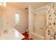 Bathroom featuring a tub and shower combo, a single sink vanity, and patterned wallpaper at 3221 5Th Street Nw Ct, Hickory, NC 28601