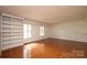 This bedroom offers built-in shelving and natural light from the two windows at 3221 5Th Street Nw Ct, Hickory, NC 28601