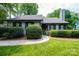 Inviting home exterior with manicured shrubs and a walkway leading to the entrance at 3221 5Th Street Nw Ct, Hickory, NC 28601