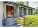 Inviting front entrance with a stone accent wall and covered porch at 3221 5Th Street Nw Ct, Hickory, NC 28601