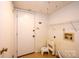 Functional laundry room features a utility sink, shelving, and an exterior door at 3221 5Th Street Nw Ct, Hickory, NC 28601