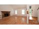 Bright living room featuring a stone fireplace, hardwood floors, and ample natural light at 3221 5Th Street Nw Ct, Hickory, NC 28601