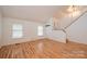 Bright living space with hardwood floors, large windows, and staircase, perfect for Gathering gatherings at 3221 5Th Street Nw Ct, Hickory, NC 28601