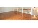 Spacious living room with hardwood floors, a wooden banister, and plenty of natural light at 3221 5Th Street Nw Ct, Hickory, NC 28601