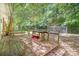 Large treed backyard with wood deck, patio and firepit at 3230 Kingsfield Rd, Rock Hill, SC 29732