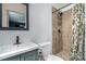 Bathroom features shower, floral curtain, vanity with sink, toilet and black-trimmed mirror at 3230 Kingsfield Rd, Rock Hill, SC 29732