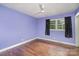 Comfortable bedroom with a ceiling fan, natural light, and hardwood flooring at 3230 Kingsfield Rd, Rock Hill, SC 29732