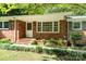 Close up of a brick home's front entry with a small porch and landscaped walkway to the front door at 3230 Kingsfield Rd, Rock Hill, SC 29732