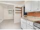 Charming kitchen featuring white cabinets, granite countertops, and a brick backsplash at 3230 Kingsfield Rd, Rock Hill, SC 29732