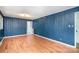 Inviting living room with wood paneling, hardwood floors, and a ceiling light at 3230 Kingsfield Rd, Rock Hill, SC 29732