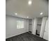 A bright bedroom with a large window, dark flooring, and ample closet space at 338 Orchard Trace Ln # 8, Charlotte, NC 28213