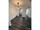 Open dining area featuring modern light fixture, sleek floors, and access to kitchen at 338 Orchard Trace Ln # 8, Charlotte, NC 28213