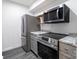 Renovated kitchen featuring stainless steel appliances and countertops at 338 Orchard Trace Ln # 8, Charlotte, NC 28213