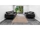 Well-lit living room features luxury vinyl flooring, and a sliding glass door to a balcony at 338 Orchard Trace Ln # 8, Charlotte, NC 28213