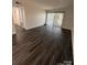 Bright living room with stylish floors and sliding glass doors to the outside at 338 Orchard Trace Ln # 8, Charlotte, NC 28213