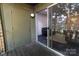 Cozy outdoor patio with sliding glass doors leading inside at 338 Orchard Trace Ln # 8, Charlotte, NC 28213