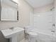 All-white bathroom features a pedestal sink and shower over tub at 346 Fieldstone Cir, Statesville, NC 28677