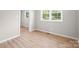 Bright bedroom with new floors, base trim and windows with views at 346 Fieldstone Cir, Statesville, NC 28677