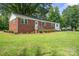 Lovely single story brick home on a lush green lot with mature trees at 346 Fieldstone Cir, Statesville, NC 28677