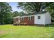 Beautiful exterior of a brick house with green grass and mature trees at 346 Fieldstone Cir, Statesville, NC 28677