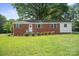 Charming brick home with manicured lawn and inviting front porch at 346 Fieldstone Cir, Statesville, NC 28677