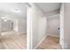 Open hallway with wood-look flooring that leads to multiple rooms at 346 Fieldstone Cir, Statesville, NC 28677