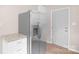Bright kitchen features stainless steel refrigerator, granite counters, and new flooring at 346 Fieldstone Cir, Statesville, NC 28677