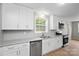 Well-lit kitchen with white cabinets, and stainless steel appliances at 346 Fieldstone Cir, Statesville, NC 28677