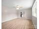 Bright living room featuring new flooring and a view into the kitchen at 346 Fieldstone Cir, Statesville, NC 28677