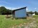 Exterior view of a cozy home with a garden bed and a small deck at 490 County Line Rd, Stony Point, NC 28678