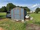 Shed exterior in a large yard with grass at 490 County Line Rd, Stony Point, NC 28678