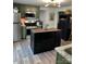Kitchen with olive cabinetry, stainless appliances, and central island at 512 S Gray St, Gastonia, NC 28052