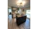 Modern kitchen with olive cabinets, stainless appliances, and kitchen island at 512 S Gray St, Gastonia, NC 28052