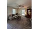 Inviting living room featuring a comfortable sectional sofa and neutral tones at 512 S Gray St, Gastonia, NC 28052