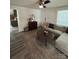 Bright living room showcasing hardwood floors, a comfortable sofa, and a view into the kitchen at 512 S Gray St, Gastonia, NC 28052