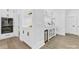 Elegant wet bar with white cabinetry, beverage cooler and stylish fixtures at 5217 Waterfall Ct, Gastonia, NC 28056